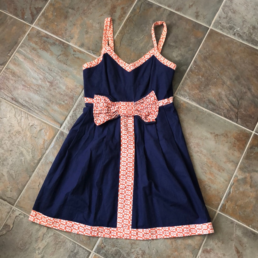 Navy mini dress with orange/white bow trim size s
